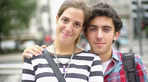 Couple looking at camera laughing Stock Footage 63296149