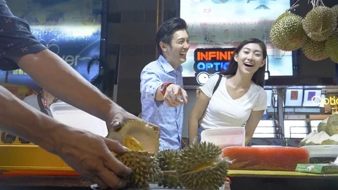 The Couple Is Looking At The Durian Fruit Process While Laughing Stock Footage 122154330