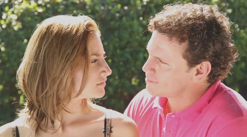 Couple looking at each other serious &amp; then smiling Stock Footage 38762585