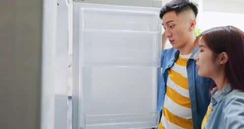 Couple looking at empty fridge Stock Footage 160257364
