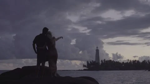 Couple looking at lighthouse Video stock 287969367