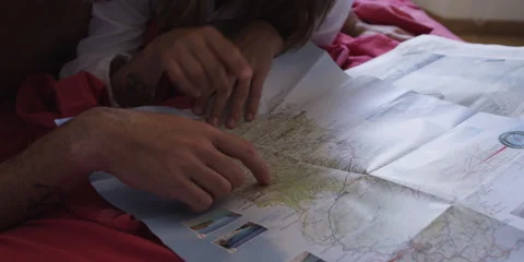 Couple looking at map Stock Footage 58860372
