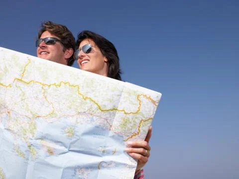 Couple looking at a map Stock Photos
