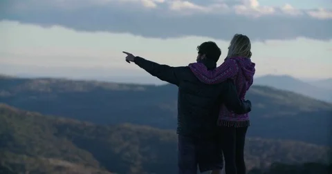 Couple looking out at mountain view 스톡 동영상 73491229