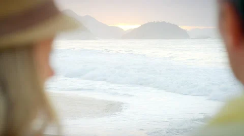 Couple looking out over the ocean Stock Footage 48004016