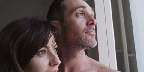 Couple looking out of the window Stock Footage 58860219