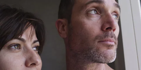 Couple looking out of the window Video stock 58860238