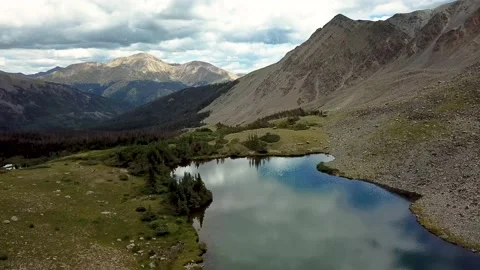 Couple Looking Over Lake 2 | Ptarmigan | Cottonwood Pass | 4K Drone Footage Stock Footage 209383692