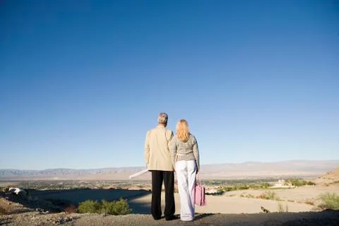 Couple Looking At Plot For New Home Stock Photos