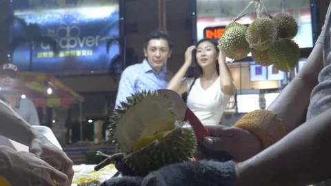 The Couple Is Looking At The Process Of Peeling Durian Fruit Stock Footage 122154326