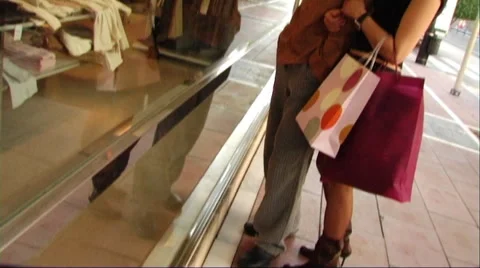 Couple looking in shop window Stock Footage 43691824