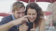 Couple Looking At Smart Phone Together Stock Footage
