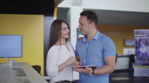 Couple is looking smth in the tablet. Stock Footage 92661640