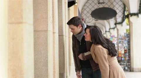 Couple looking at store showcase in city Stock Footage 33528557