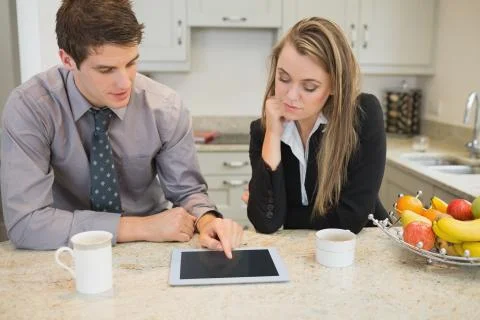 Couple looking at tablet pc Stock Photos
