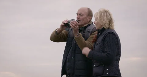 Couple looking through binoculars Stock-Footage 59899642