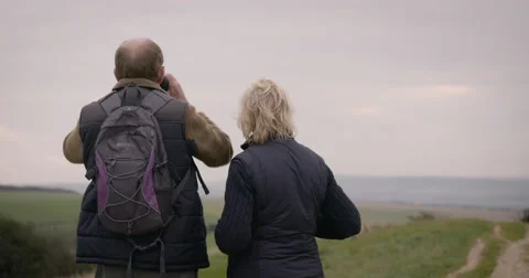 Couple looking through binoculars Stock Footage 59899647