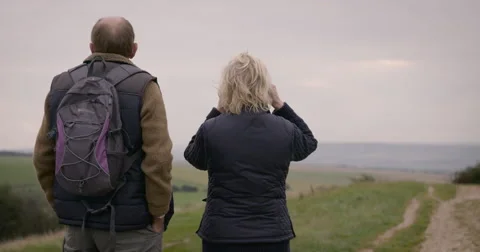 Couple looking through binoculars Stock-Footage 59899649