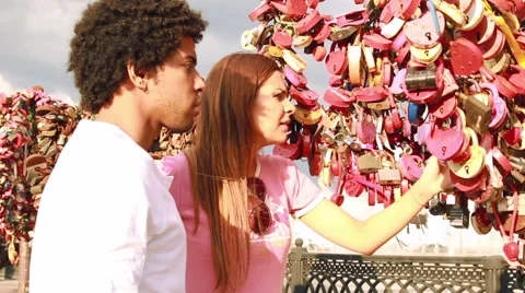 Couple looking at tree with love locks Stock Footage 51870837