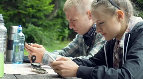 Couple looking very absorbed while using modern technologies Stock-Footage 67577511