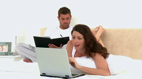 Couple looking at a video on the computer Stock Footage 1017885