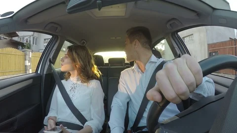 Couple looking for wrong address using gps and going into reverse Stock Footage 85598273