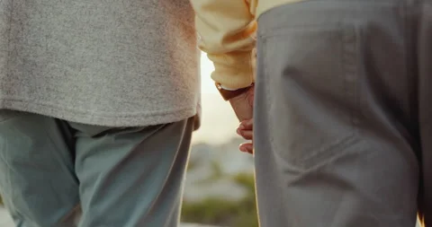 Couple, love and holding hands and walking on beach for care, commitment or 動画素材 255001053