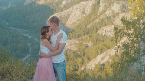 Couple in love on a background of mountains Stock Footage 99230564