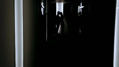 Couple in love in backlight in building background Stock Footage 303533866