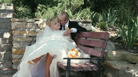 A couple in love on a bench Stock Footage 197897637