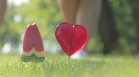Couple in love. Candy on the grass Stock Footage 52392827