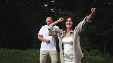 A couple in love is dancing and having fun in nature Stock Footage 320121332