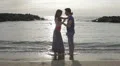 couple in love dancing and kissing on the beach at sunset - sea and love HD Footage
