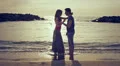 couple in love dancing and kissing on the beach at sunset - sea and love HD Footage