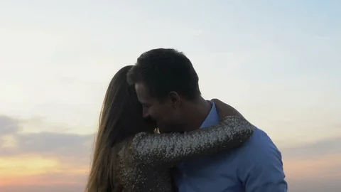 Couple in love dancing together under beautiful evening sky, magic hour, date Stock-Footage 117196558