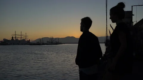A couple in love embracing while watching a sunset in San Francisco. Stock Footage 89561298