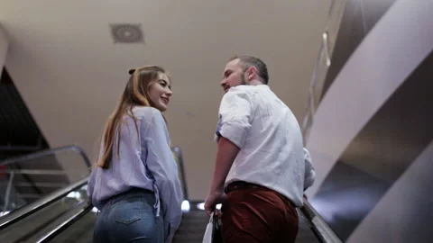 Couple in love on the escalator Stock Footage 98361204