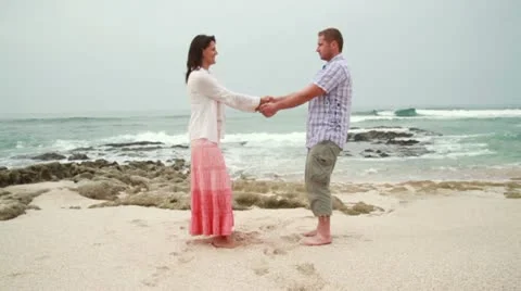 Couple in love having fun on the beach Stockbeeldmateriaal 10839906