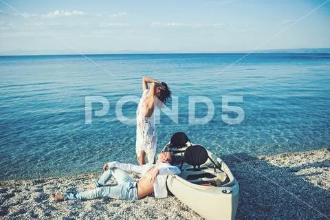 Couple in love relax on beach. Summer holidays and travel vacation. Love Stock Photos