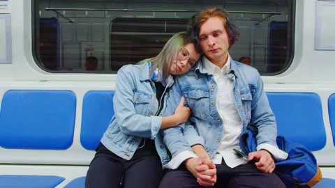 Couple in love rides in half-empty subway car Video stock 159000510
