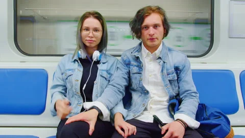 Couple in love rides in half-empty subway car Video stock 201888235