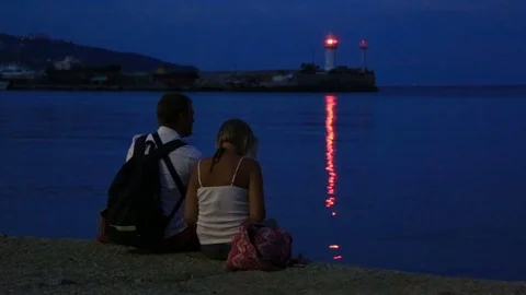 Couple in love on the seafront in the evening Stock Footage 80048064