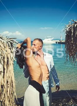 Couple in love with sexy body relax on beach. Love relations of naked couple at Stock Photos