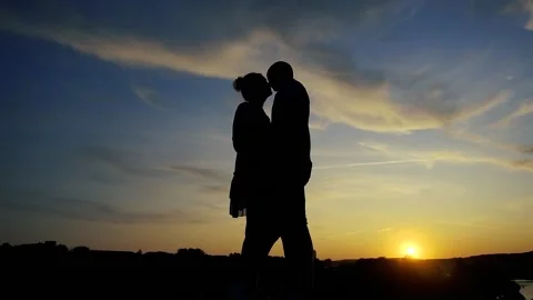 A couple in love at sunset Stock Footage