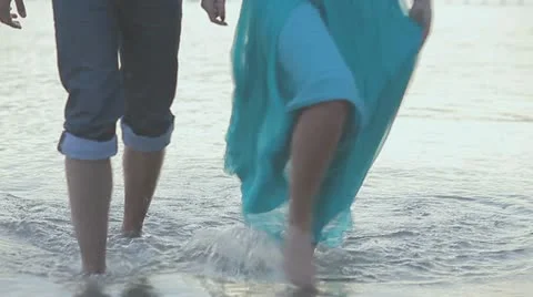 Couple in love walking on the shallow Stock Footage 10859965