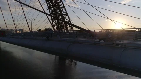 A couple of lovers is on the cable-stayed bridge over the river Stock Footage 106194209