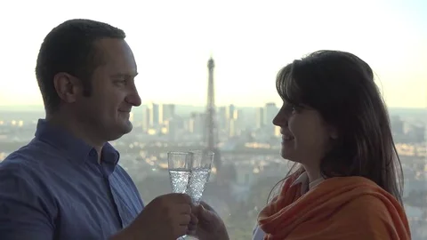 Couple of lovers drink champagne, Eiffel tower in background Stock Footage 69181326
