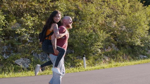 A couple of lovers have fun while walking Stock-Footage 135792443