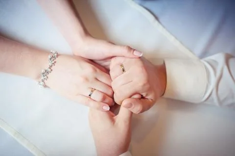 Couple of lovers hold hands. Stock Photos