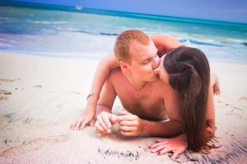 Couple lying on the beach Foto stock